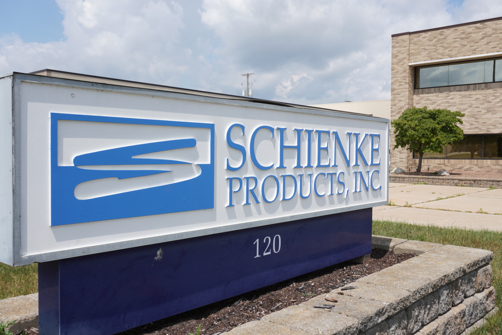 The Schienke Products sign outside the company facility at 120 McLean Dr in Romeo, Michigan